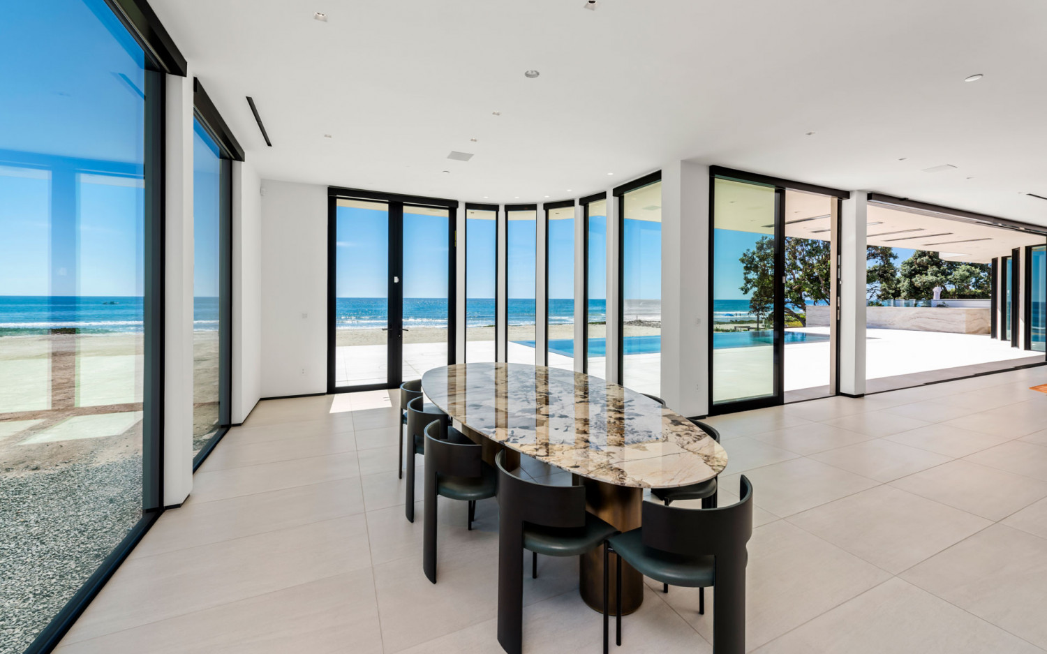 Indoor dining space in Malibu beachfront estate with panoramic ocean views